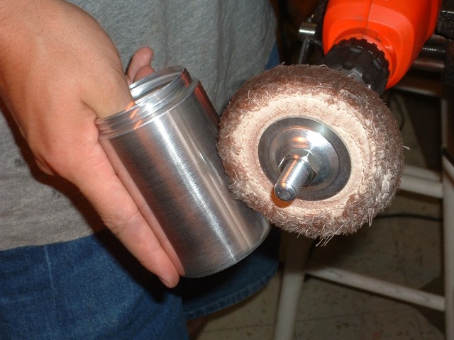 Buffing the shakers on a cotton wheel.