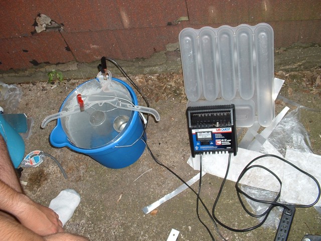 A picture of the annodizing setup, showing the battey charger.
